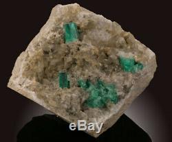 Emerald Crystals on Matrix. A calcite piece with Emerald crystals disbursed