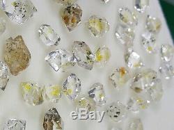 Petrolium diamond quartz Crystals 42 pieces with Yellow visible petrol inside