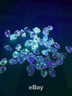 Petrolium diamond quartz Crystals 42 pieces with Yellow visible petrol inside